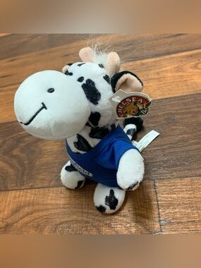 Stonyfield Organic cow plush toy with a blue branded t-shirt